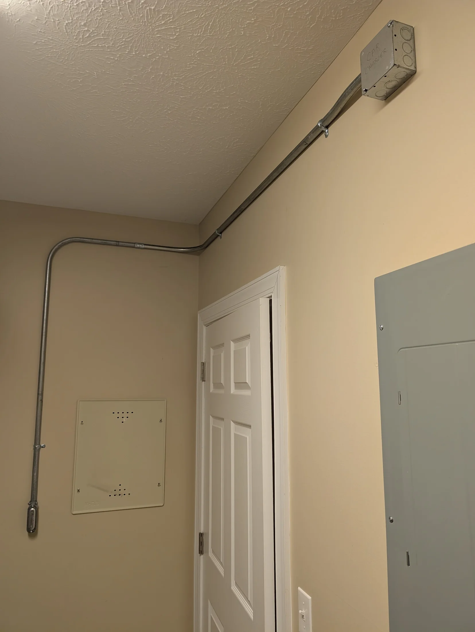 Surface-mounted EMT conduit and junction box installation by State of the Arc Electric